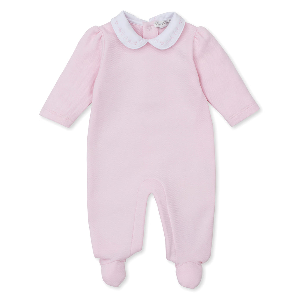Light pink jacquard Pima cotton baby girl’s footed romper with white Peter Pan collar featuring delicate pink embroidery.