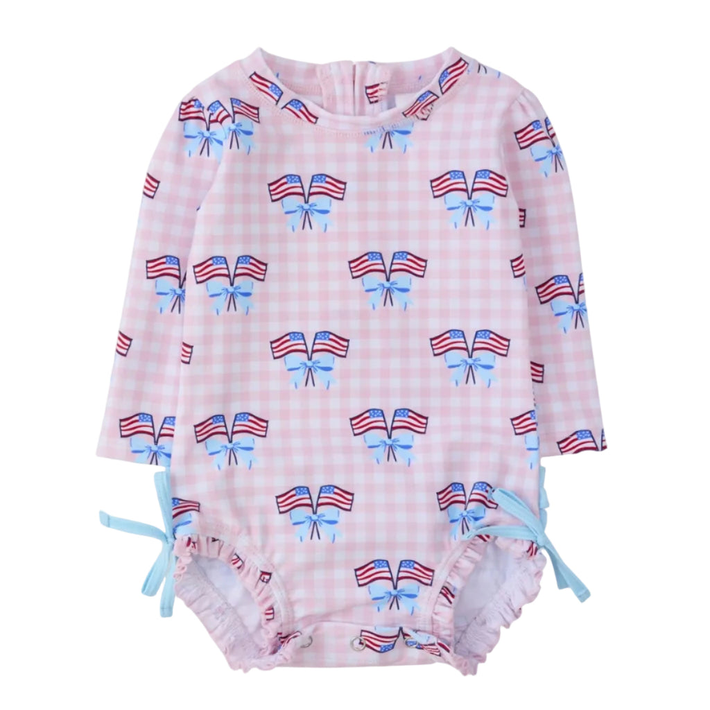Baby girl long sleeve one piece swimsuit with patriotic American flag and bow pattern.