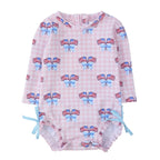 Baby girl long sleeve one piece swimsuit with patriotic American flag and bow pattern.