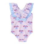 Back view of a girl’s one piece patriotic bathing suit with bow and American flag pattern on a pink gingham check background with blue bow.