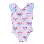 Girl’s one piece patriotic bathing suit with bow and American flag pattern on a pink gingham check background with blue ruffle sleeves.
