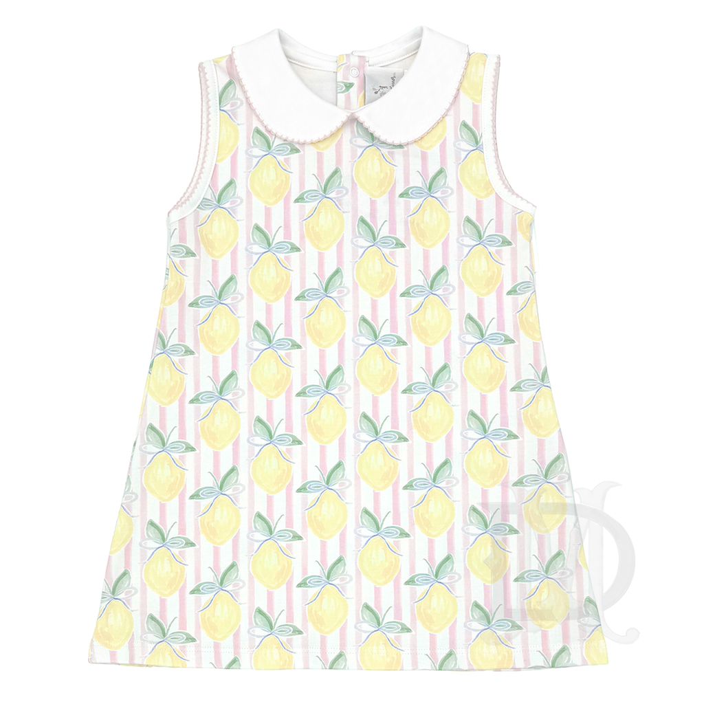 Little girl's sleeveless summer dress with a white collar in a lemon pattern on a pink stripe background.