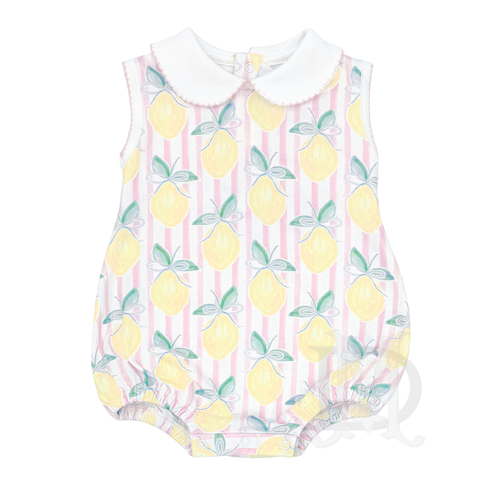 Baby girl's sleeveless summer bubble with a white collar in a lemon pattern on a pink stripe background.