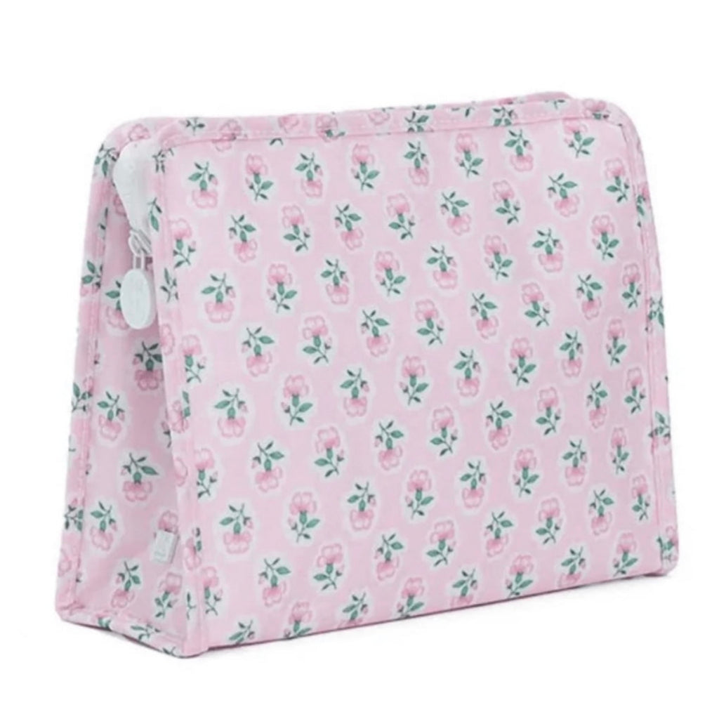 A pink and green floral print cosmetic pouch travel bag with a white zipper pull.