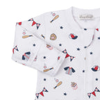 Closeup of a baby boy zip front footie with a baseball print pattern and Kissy Kissy brand label