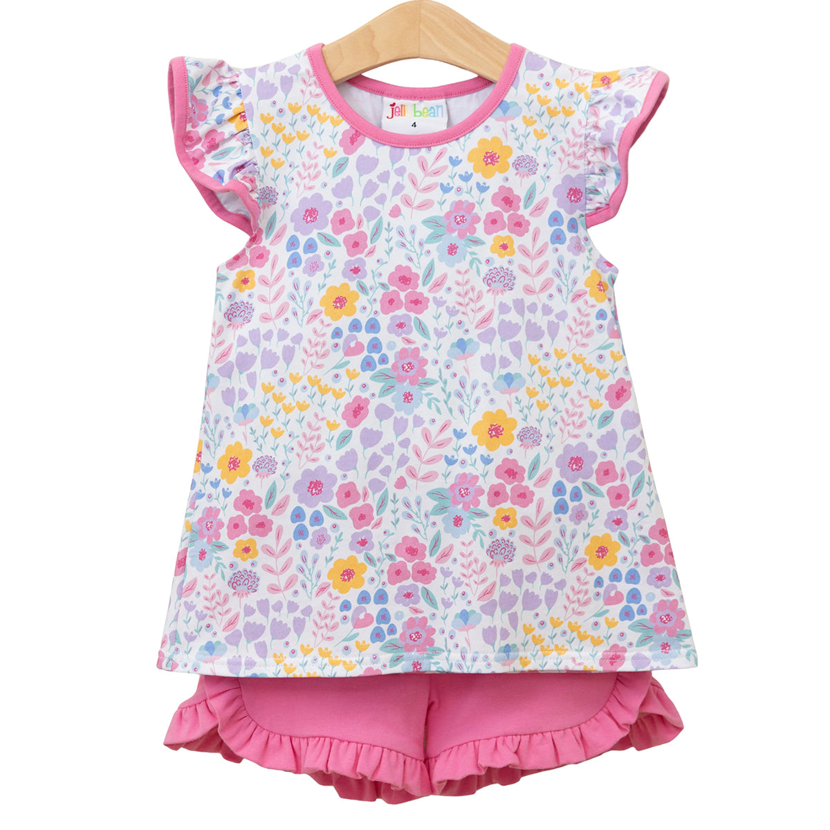 Little girl's summer floral top and pink ruffled shorts outfit.