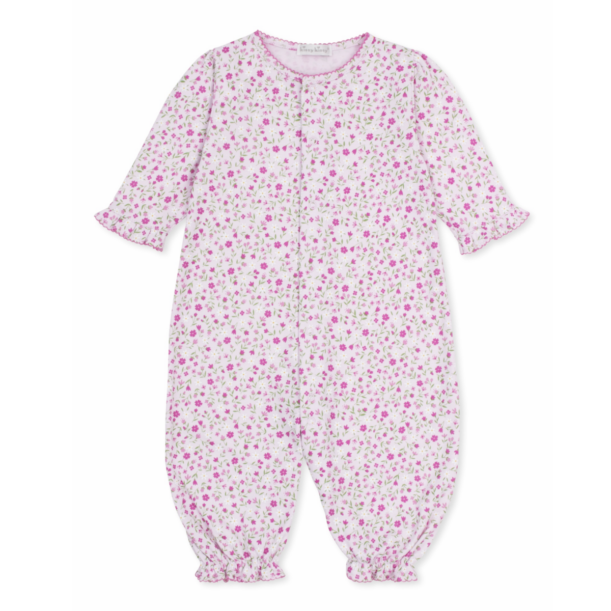 A baby girl pink converter gown playsuit with a floral print, hot pink trim, and ruffles at the wrists. 
