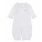 A white long-sleeve baby girl converter gown with ruffled collar and cuffs, light blue trim and a delicate embroidered bow with pink rosettes. 