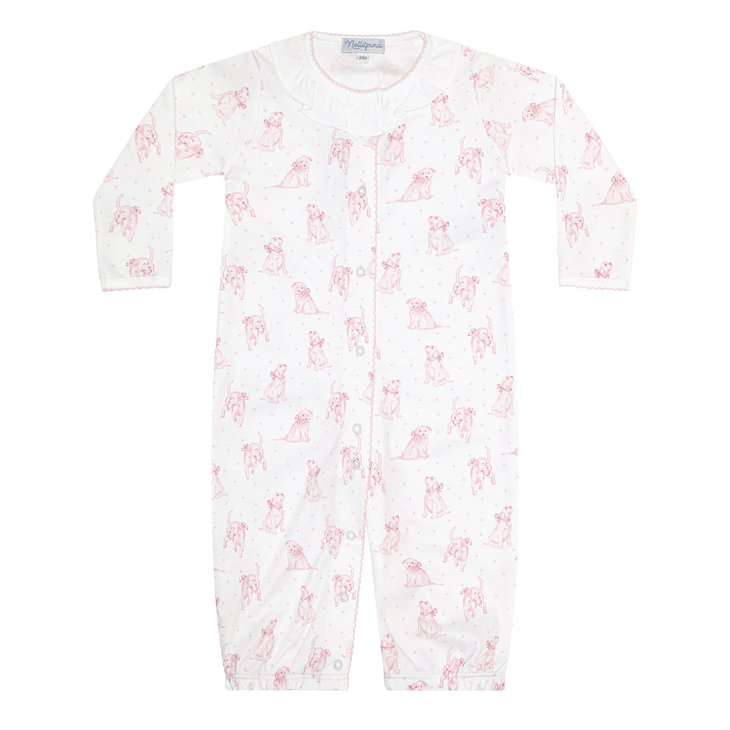 Baby girl's white converter gown romper in a pink puppy dog print with a white ruffled collar.