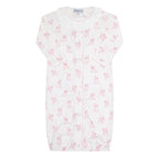 Baby girl's white converter gown in a pink puppy dog print with a white ruffled collar.