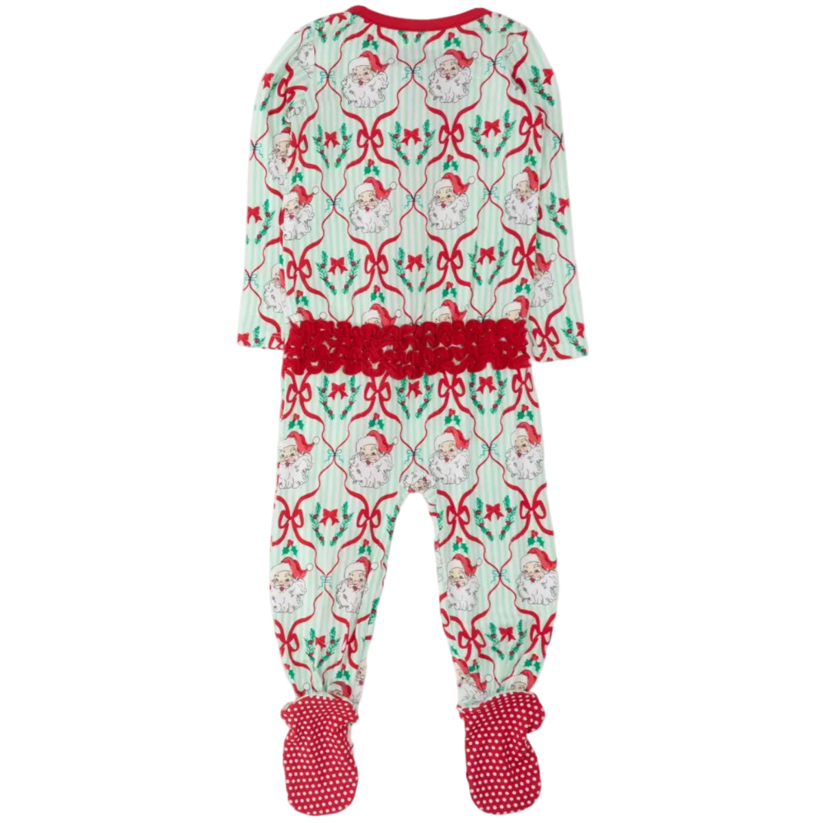 A baby footed pajama set featuring a festive Christmas print with Santa Claus, red bows, and holly on a white and green striped background, complete with a red ruffle waistband and red polka dot mittens.