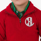 Red pullover with a monogram on a white background