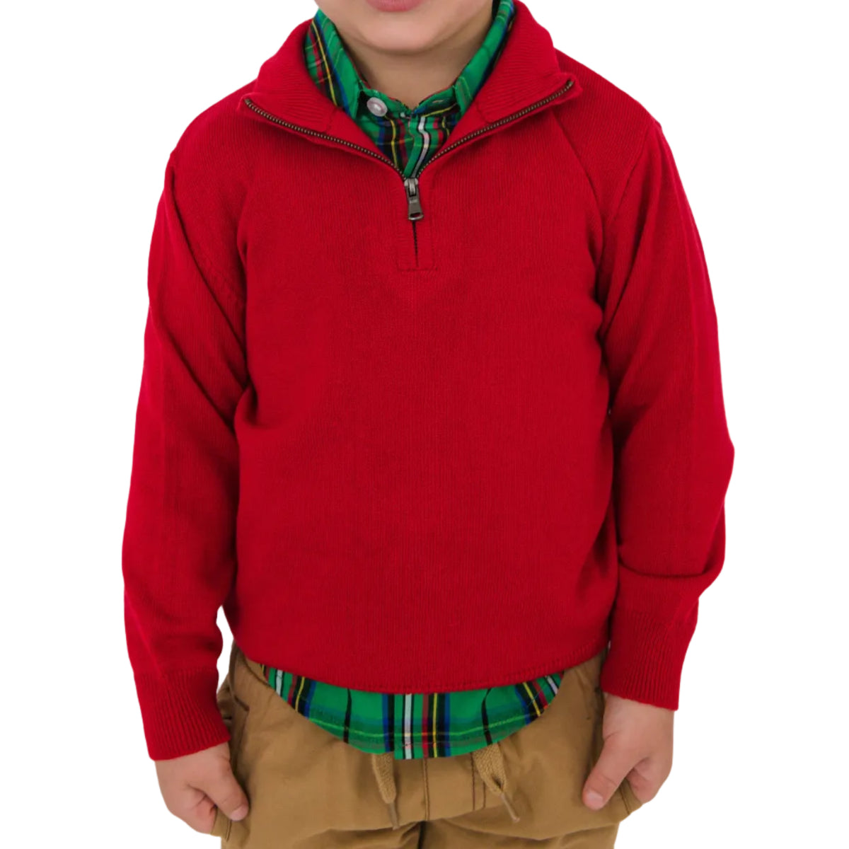 Child wearing a red sweater over a plaid shirt on a white background