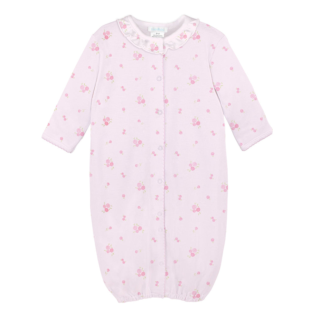Baby girl pink knit converter gown with rose print, ruffle neckline, and snap closures