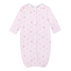 Baby girl pink knit converter gown with rose print, ruffle neckline, and snap closures