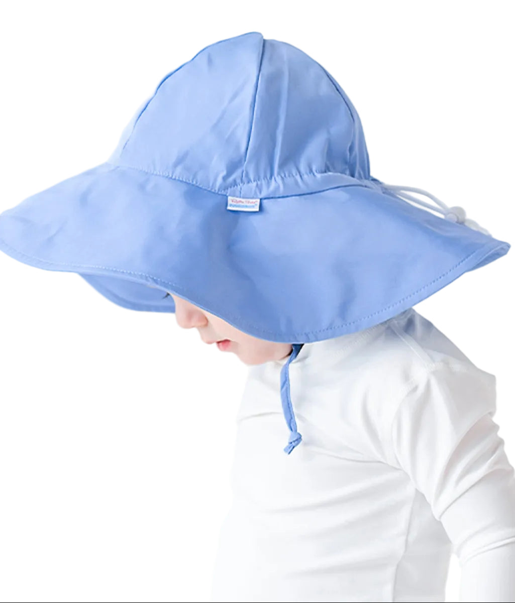 Child wearing a light blue sun hat with a chin strap