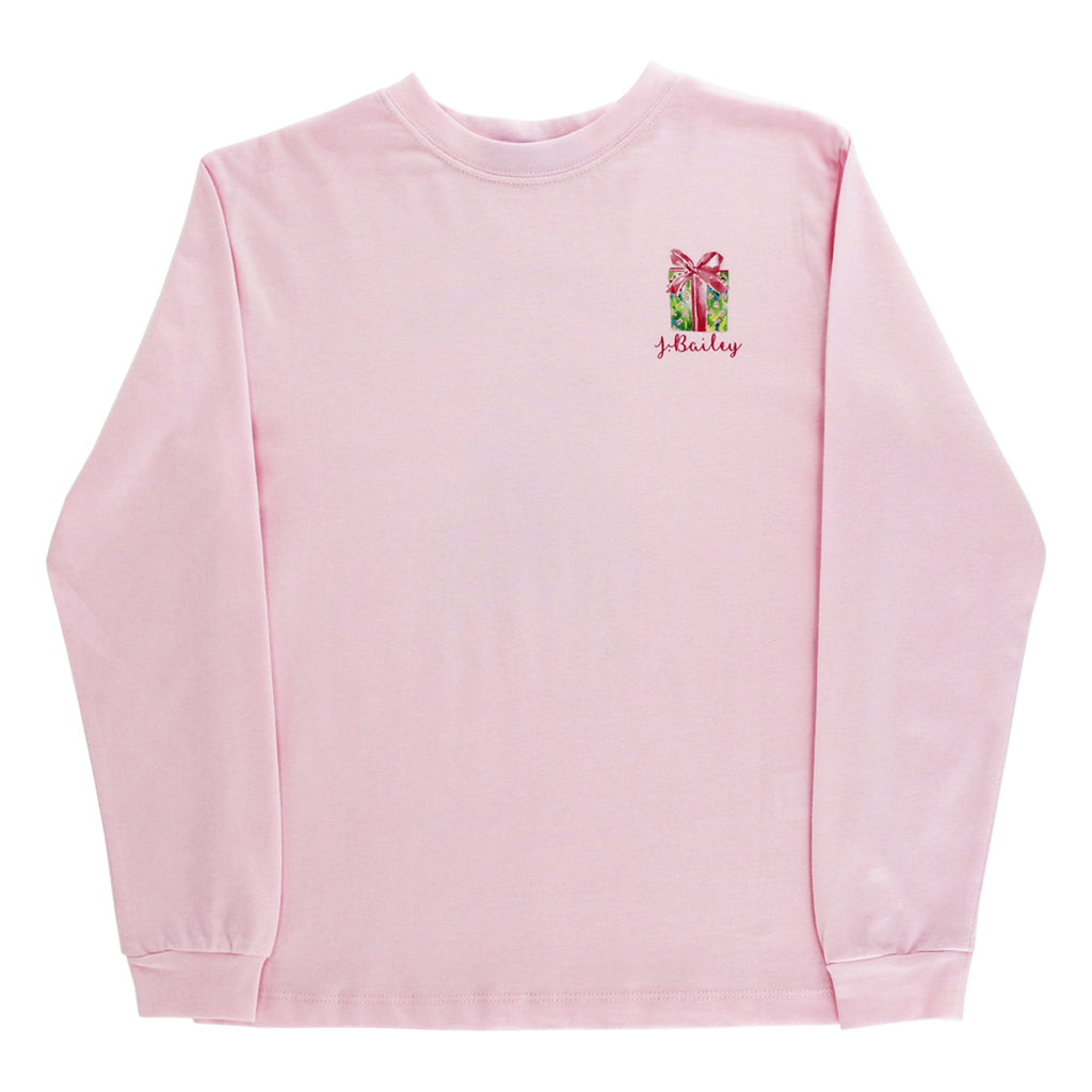 Pink long sleeve t-shirt with a small Christmas present and J. Bailey logo on the front