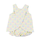 The criss cross back of a girls pale yellow summer bloomer set with a pastel sailboats print design.
