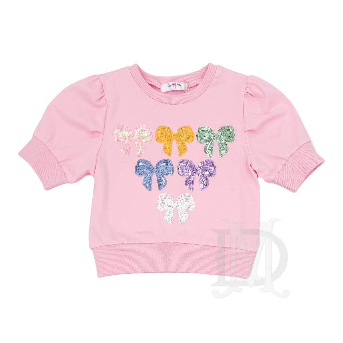 Pink short sleeve shirt with colorful sequin bow designs.