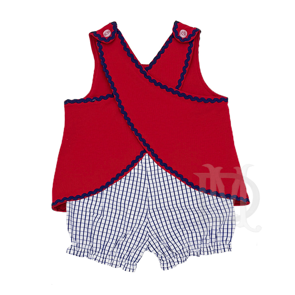Red sleeveless crossback top with navy ric-rac trim and blue windowpane checkered bloomers.