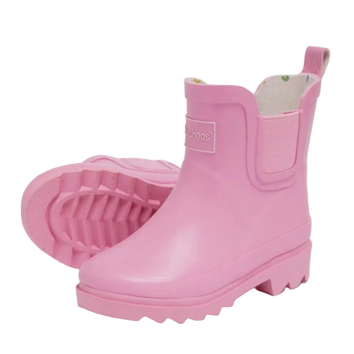 Girl's bubblegum pink ankle high rubber rainboots.
