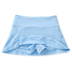 Girls blue athleisure tennis skirt with built-in shorts and back zipper pocket