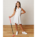 Girl modeling a pastel golf print zip tennis dress