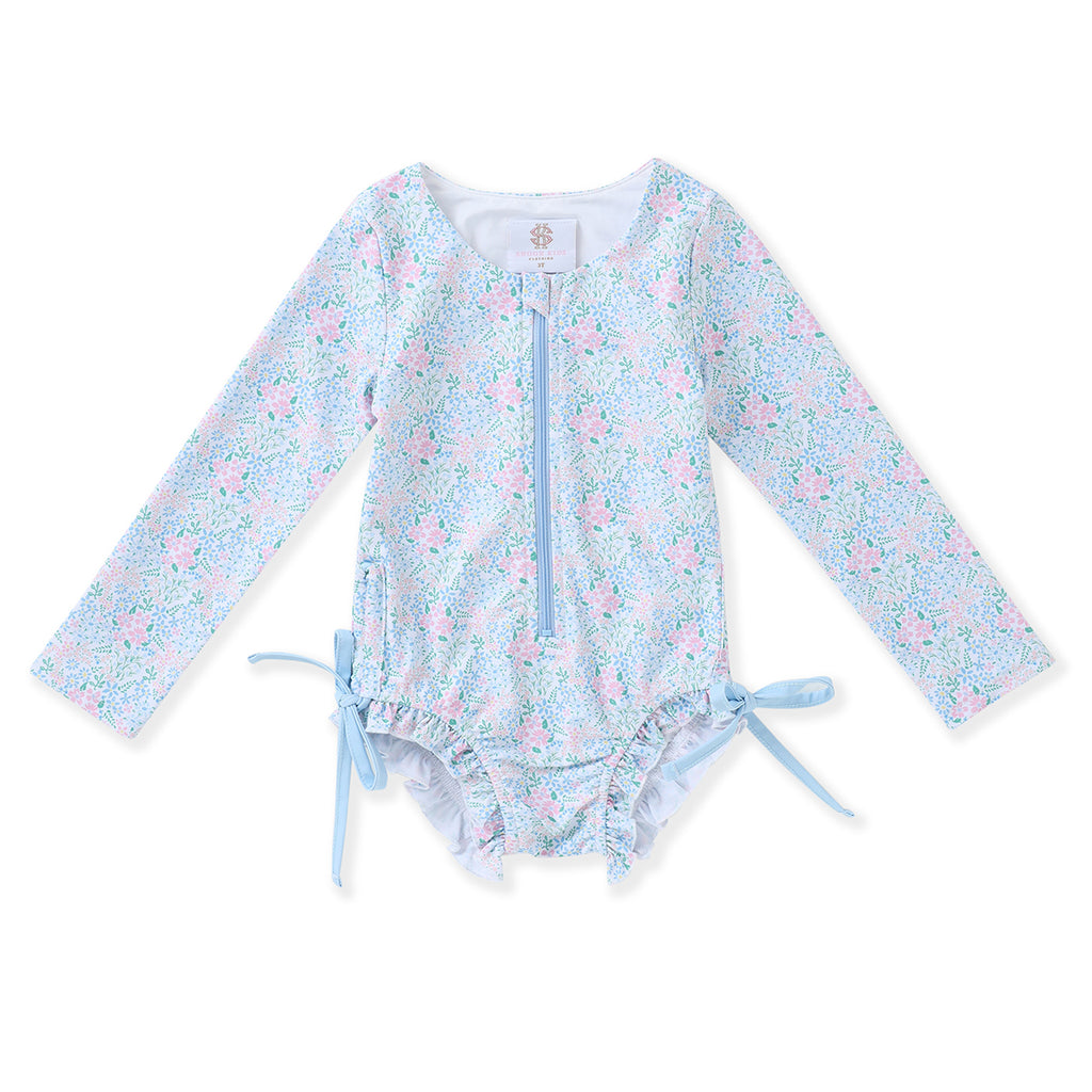 Girl's floral one-piece swimsuit with long sleeves, zipper front, and bows at the hips.