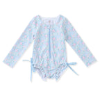 Girl's floral one-piece swimsuit with long sleeves, zipper front, and bows at the hips.