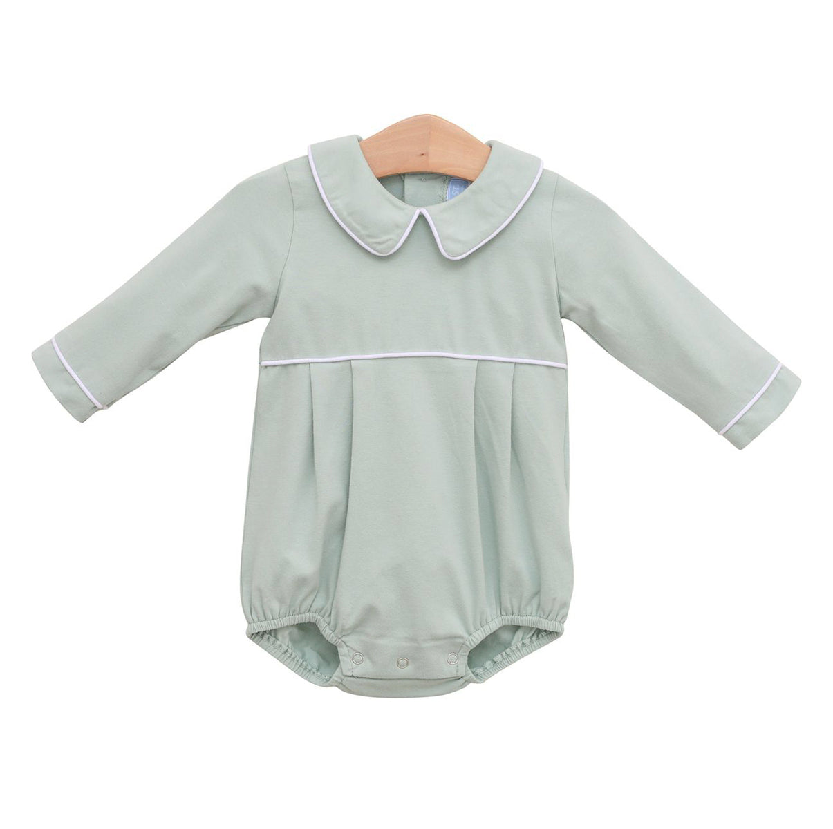 A baby boy long-sleeve romper in a pale sage green color featuring a Peter Pan collar and white piping details.