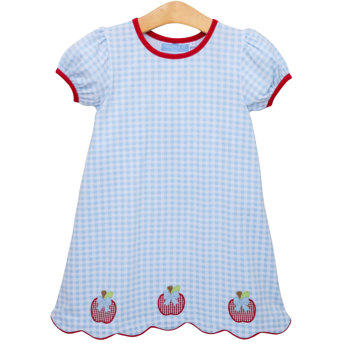 Girls back to school dress with blue checkered pattern, appliqued red apples, and red trim.