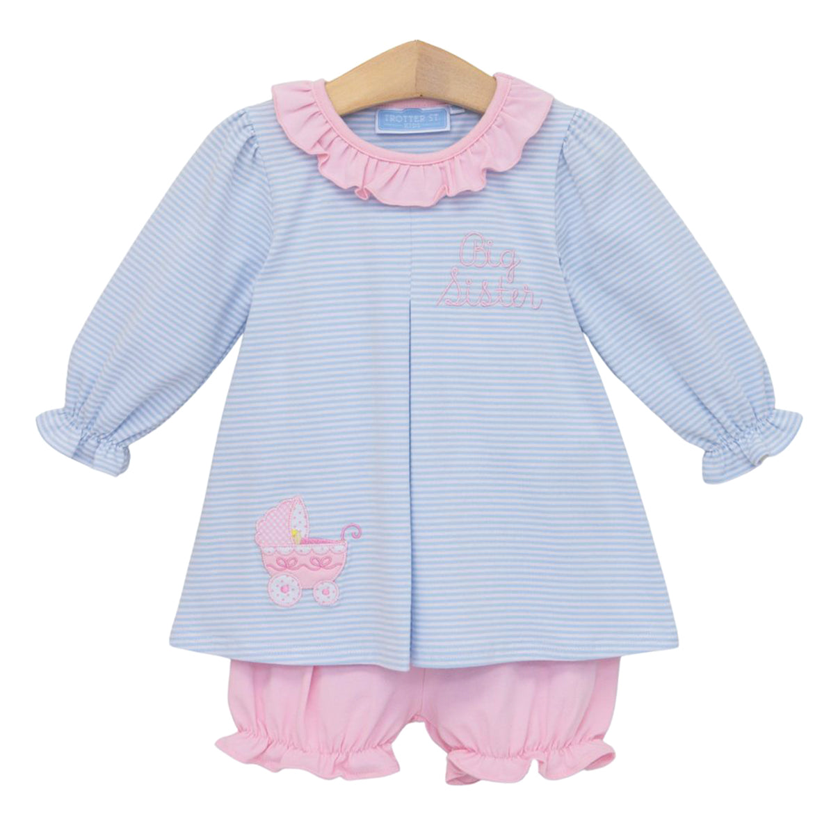A little girl's two-piece outfit consisting of a light blue and white striped long-sleeve top with pink ruffle trim and a pink embroidery that reads 'Big Sister'  and an appliqued baby carriage paired with matching pink ruffled bloomers.