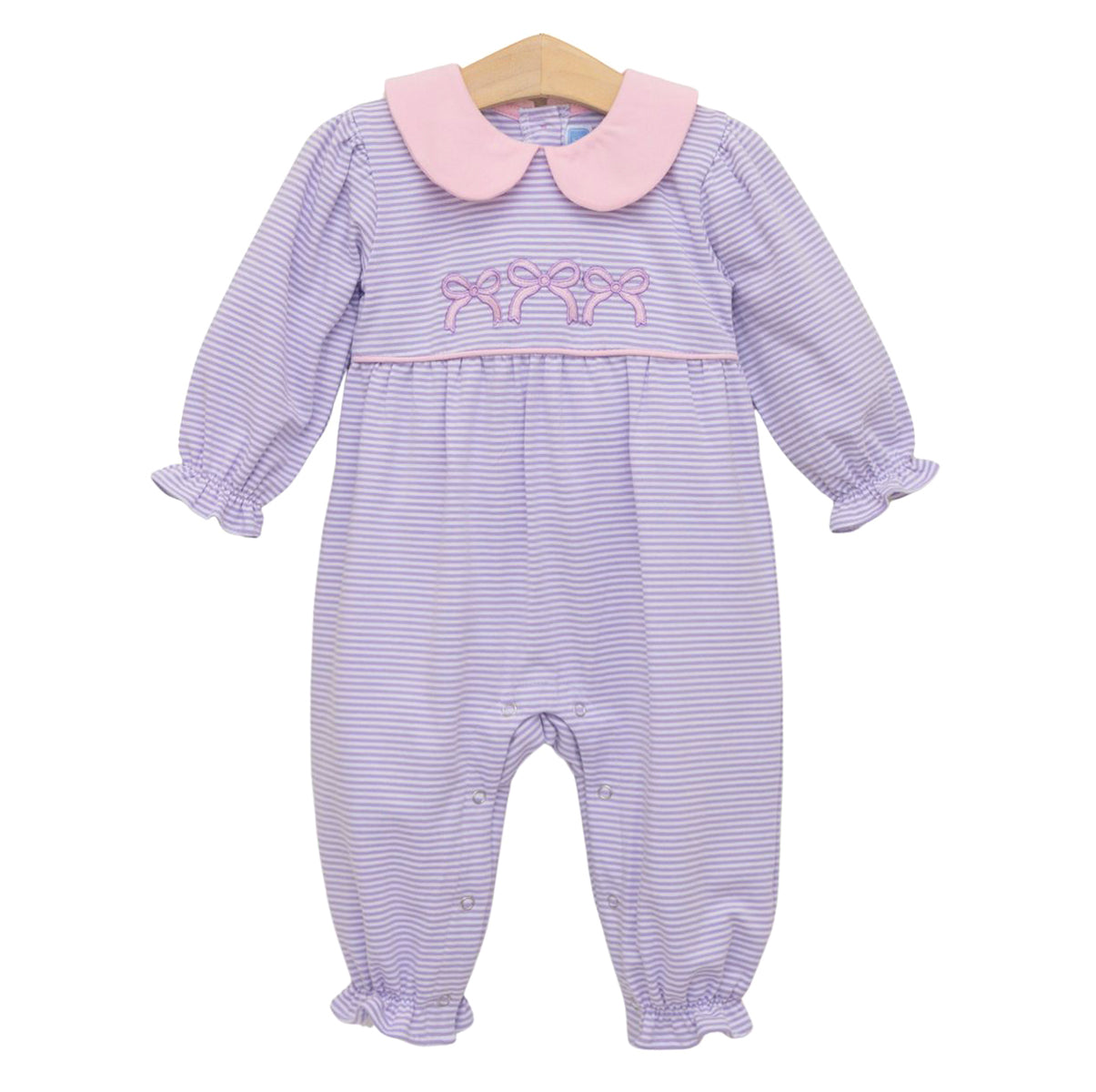 A baby girl's long-sleeve footless romper with a lavender and white stripe pattern, a pink Peter Pan collar, and pink embroidered bows on the chest.