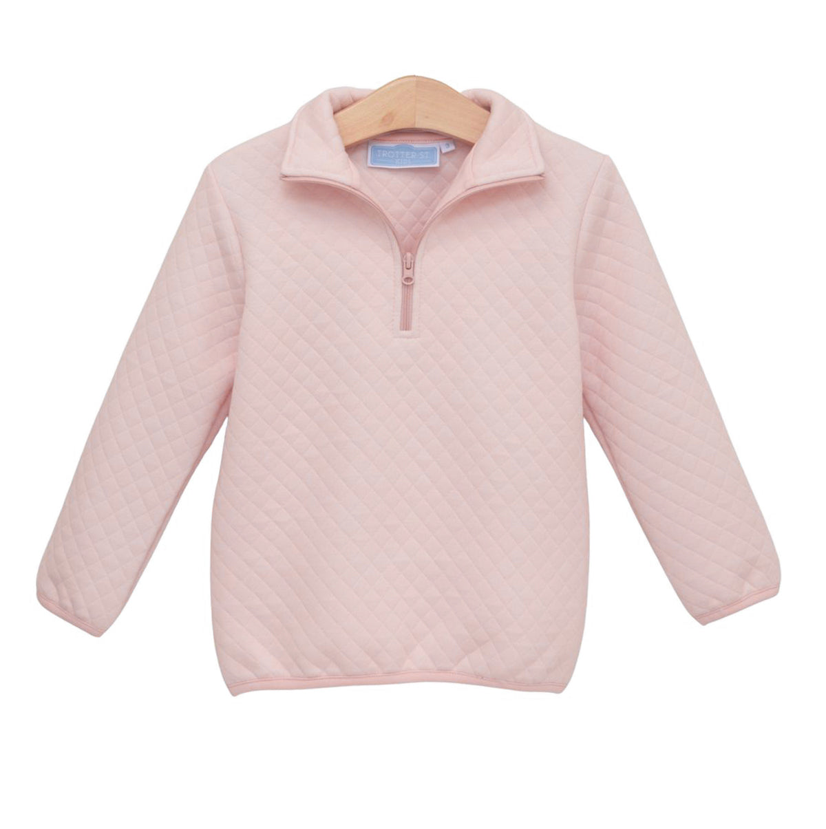 A light pink quilted long-sleeve quarter-zip pullover sweater.