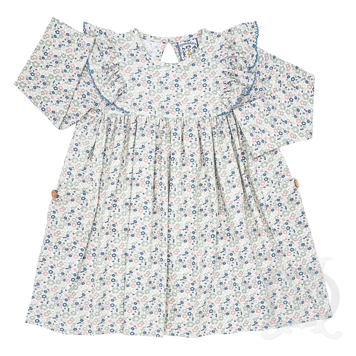 A long-sleeve girl's dress with a delicate blue, rose, and sage floral print on a cream background, featuring ruffled shoulder details.