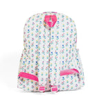 The back of a bright floral print little girl backpack with hot pink trim.